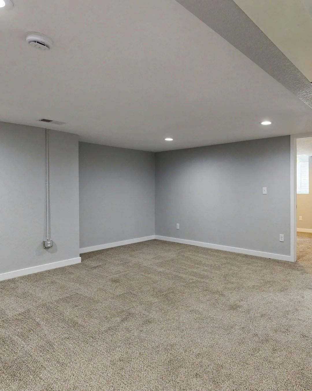 Cozy carpet finishing a basement family room