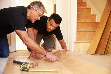 Flooring installation crew working in a Boone County home