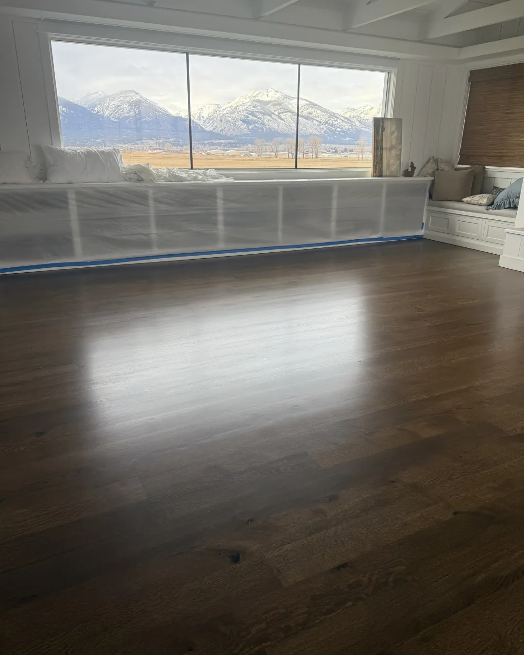 Luxury vinyl plank running into the next room