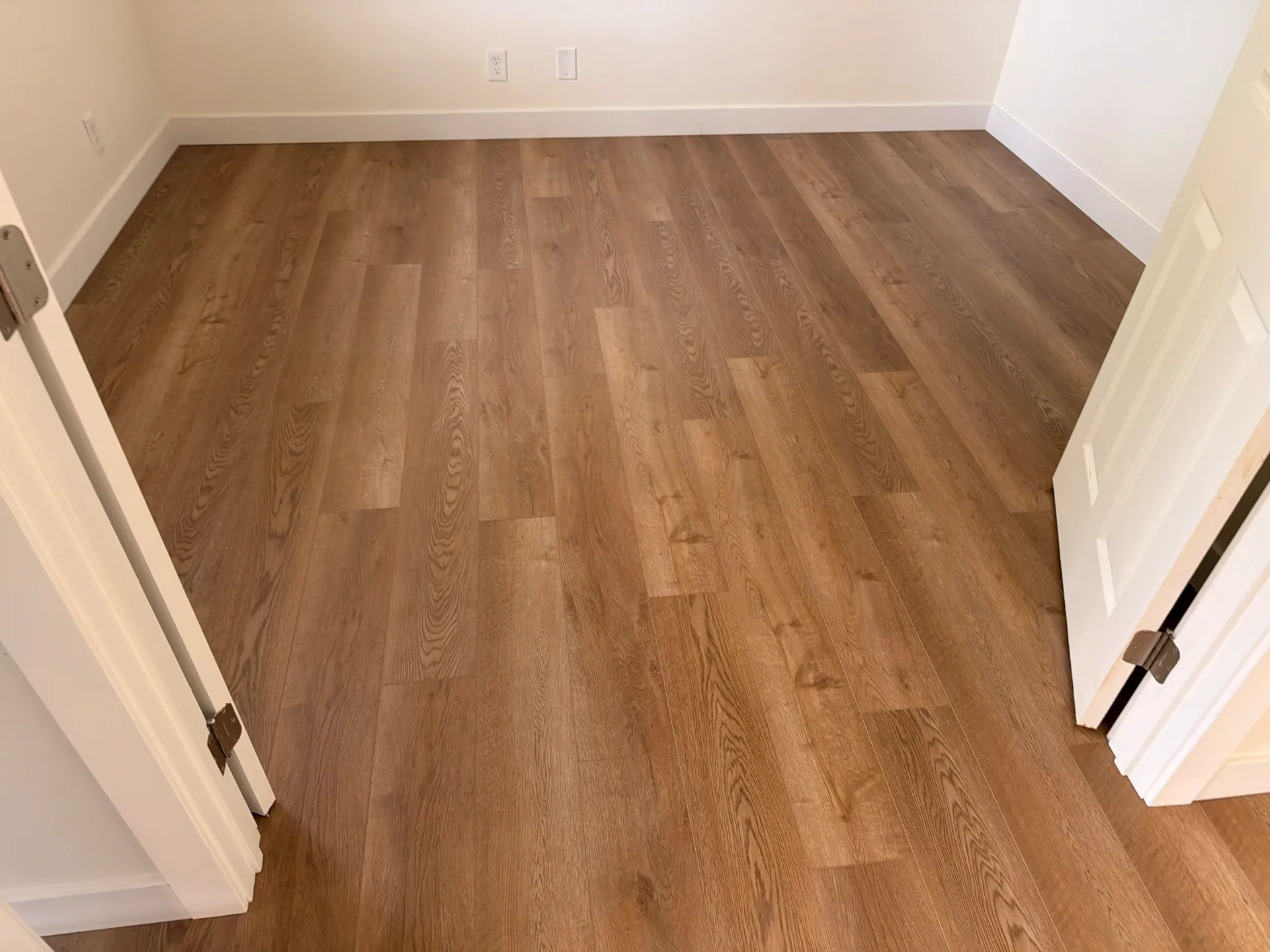 Comparing laminate and luxury vinyl finishes side by side